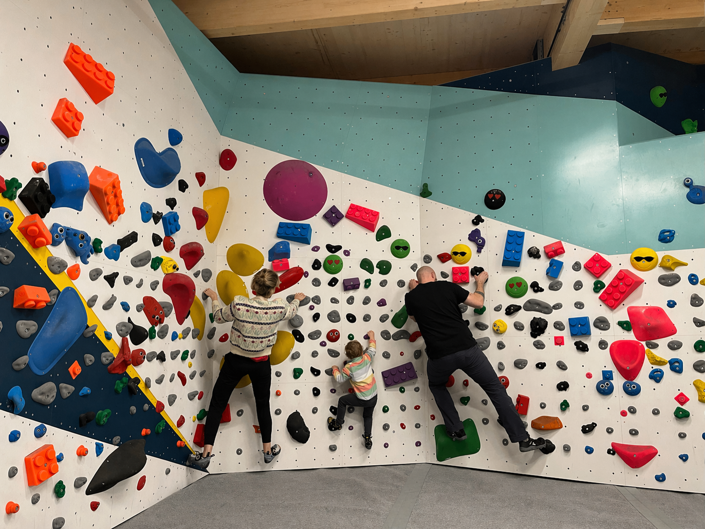 Parent and child at an indoor climbing centre